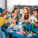 medium-shot-kids-sitting-together-table